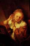 Рембрандт, Молодая женщина, примеривающая серьги (380*453)